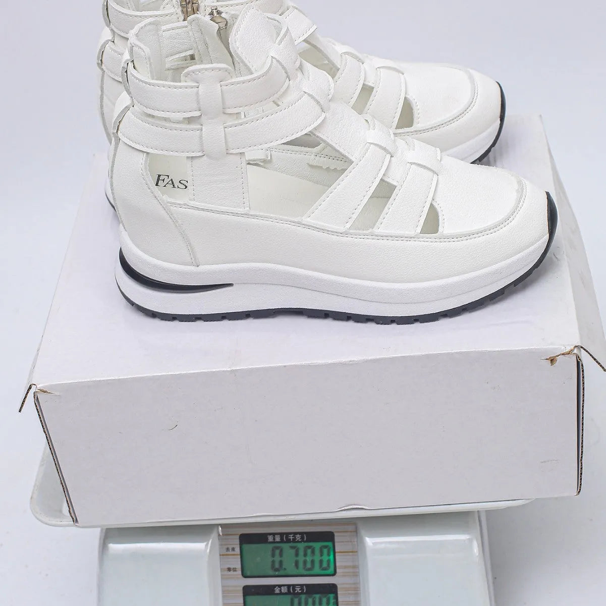 Women's black hollow-out platform sandals with a Velcro strap and round toe.