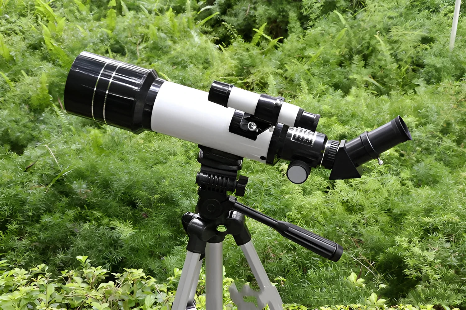 Dark blue children's astronomical monocular telescope with tripod showing 16X-66X magnification