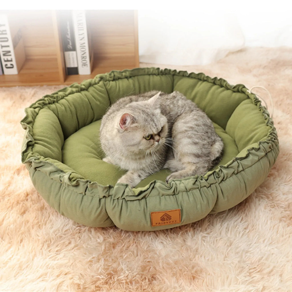 Grey and green reversible donut pet bed for cats and small dogs showing dual sleeping surfaces