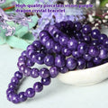 Transparent charoite crystal bracelet on a platinum metal band, showing different bead size options.