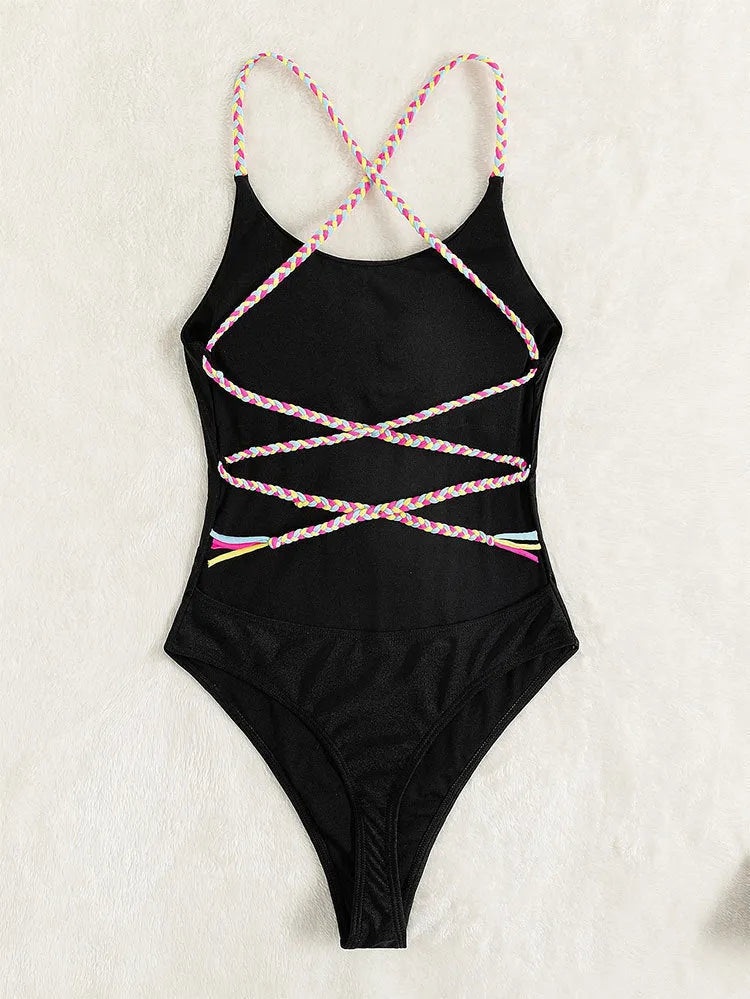 Black backless one-piece swimsuit with sleeveless design on mannequin
