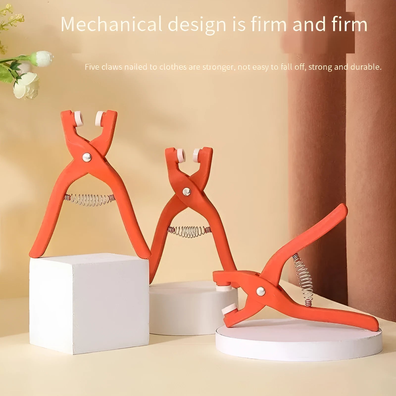 Stainless steel five claw no-sew clothing button and application pliers for children's garments.
