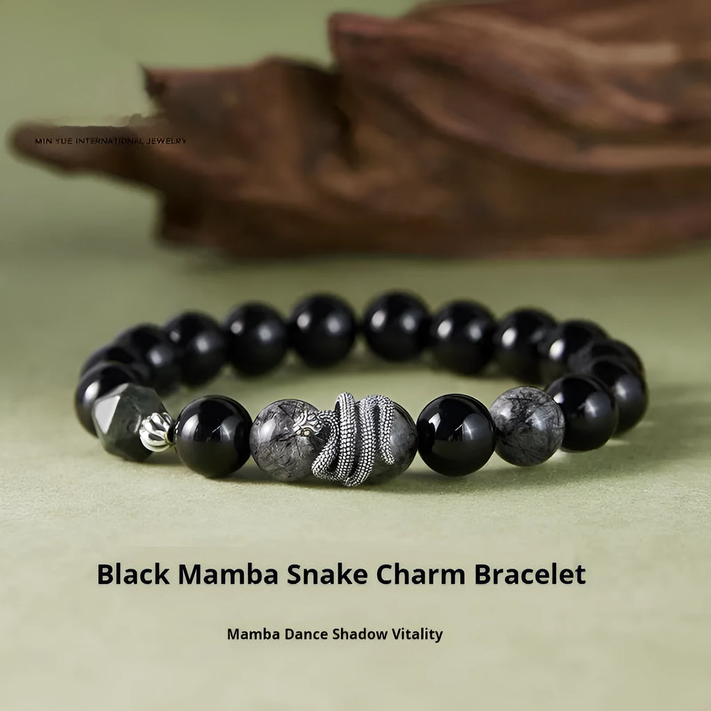 S925 sterling silver snake bracelet with obsidian black hair crystal centrepiece on wrist