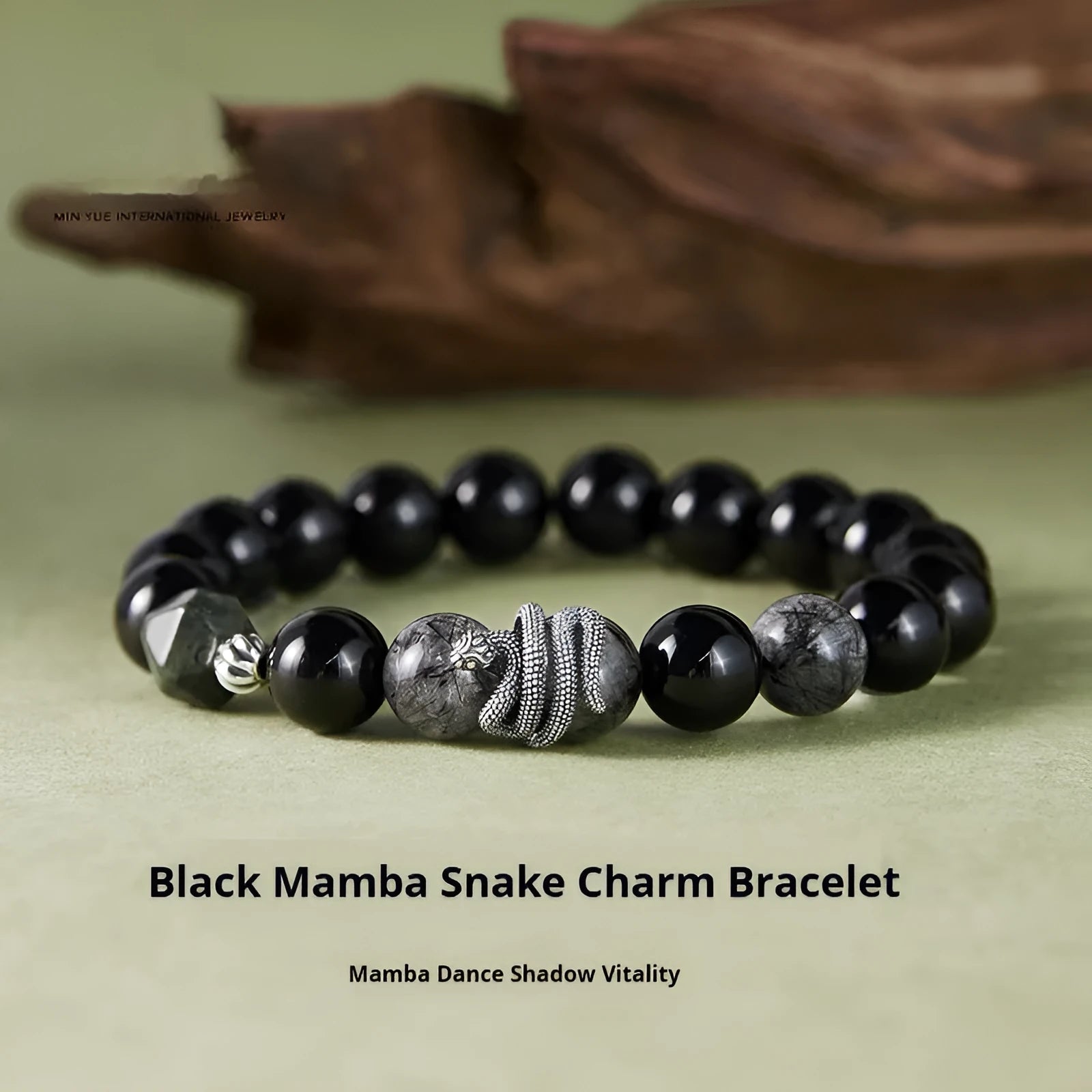 S925 sterling silver snake bracelet with obsidian black hair crystal centrepiece on wrist