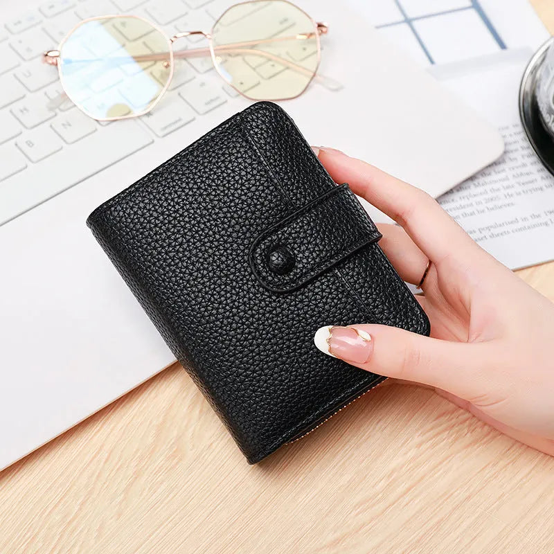 Ladies' short two-fold wallet with textured lychee pattern in beige, pink, black, and red colour options.