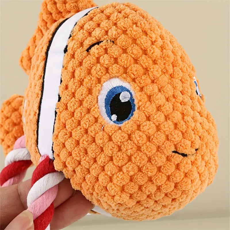 Turtle-shaped dog chewing toy with knotted fabric texture in orange colour
