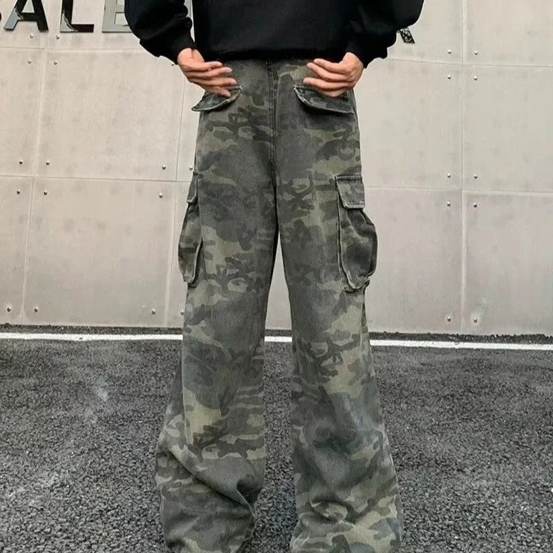 Washed camouflage cargo trousers with multiple pockets on a mid-waist fit.