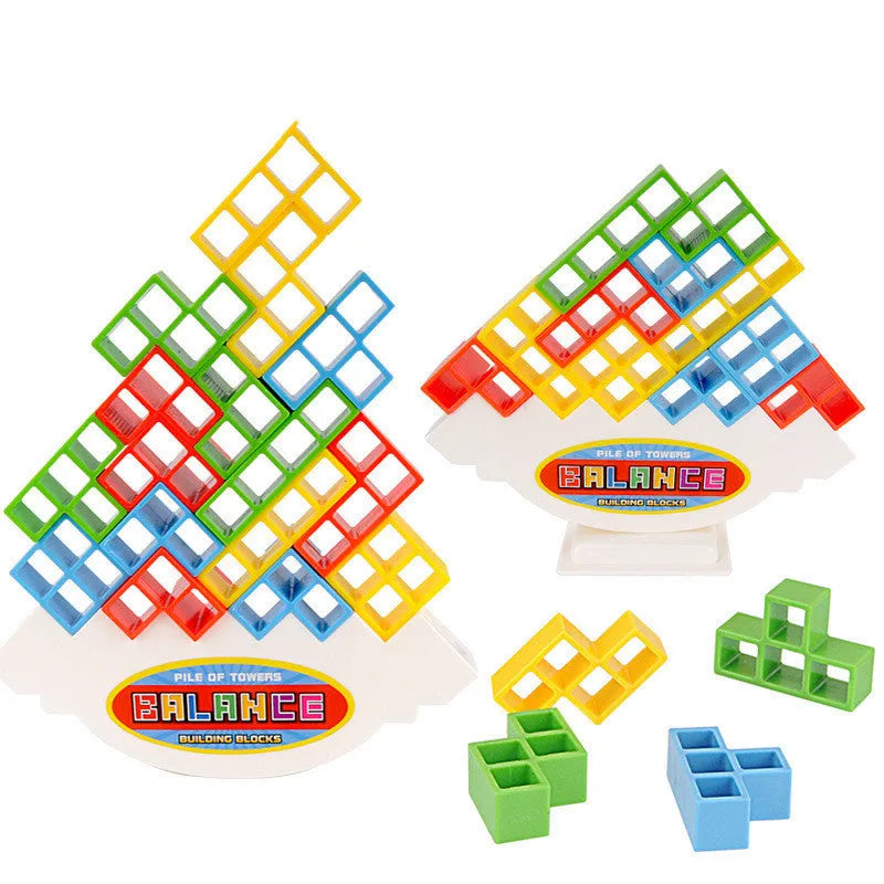 Plastic balance stacking game with 16 coloured blocks, chassis, and base on a table.