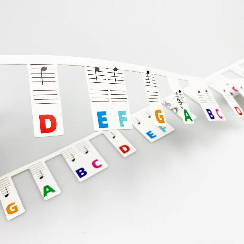 88 key piano note bar keyboard stickers on white card showing black and color note options for music learning