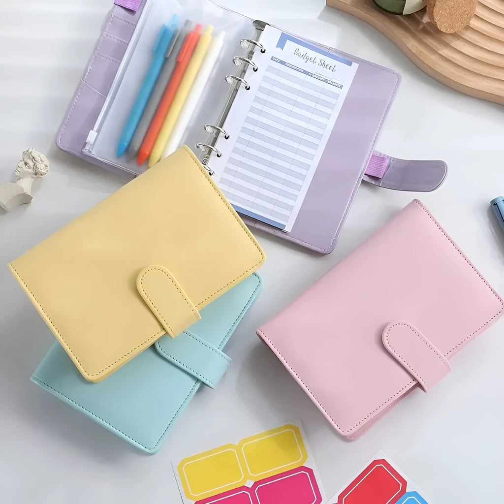 A5 PU leather notebook binder shell with zipper closed, shown in a selection of solid colours.