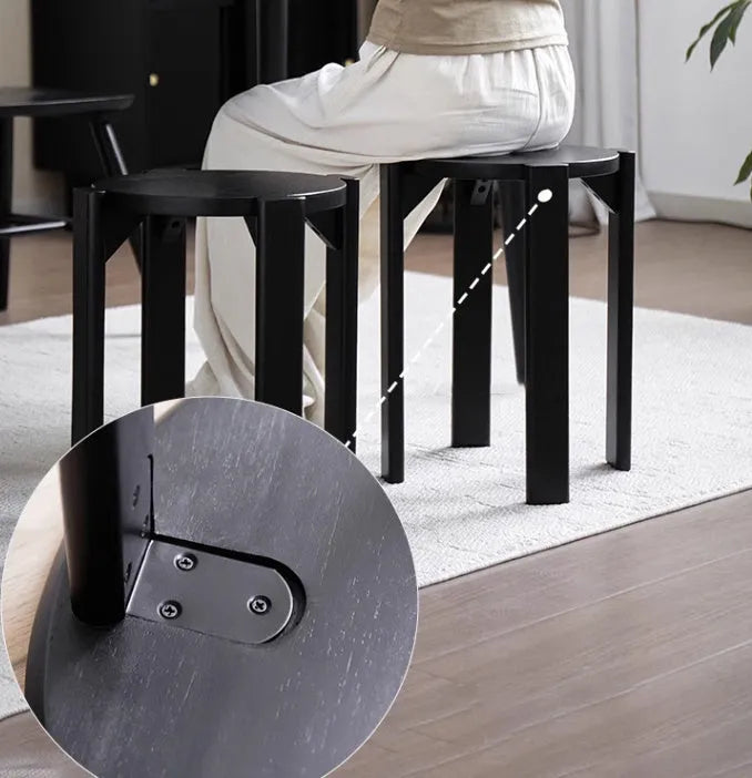 Stackable round metal dining stool in smoked black walnut finish with modern simple design
