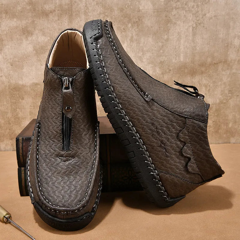 Men's black slip-on casual loafers with a round toe and rubber sole on a white background.