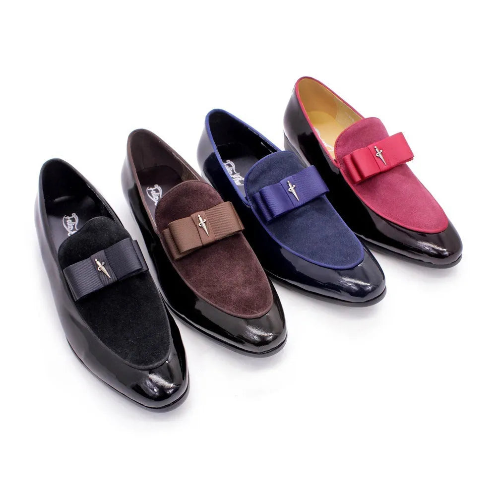 Men's black leather shoes with patent leather finish and a decorative tassel on the front.