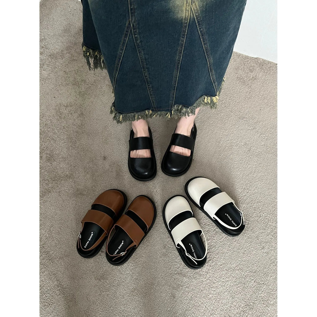 Retro closed-toe sandals with an adjustable ankle strap buckle in black, brown, or apricot colour.