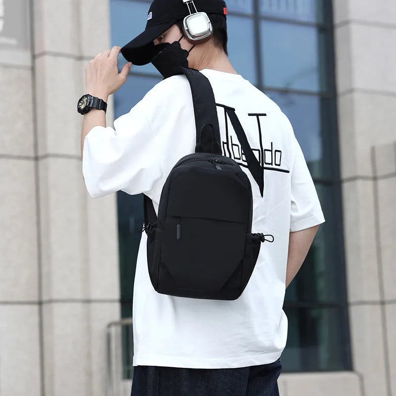 Men's grey waterproof polyester chest bag showing 33cm height dimension
