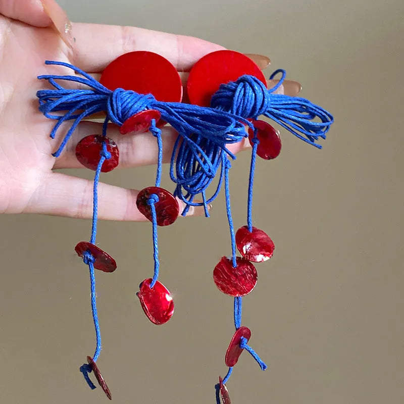 Geometric cloth earrings with blue resin flower and silver needle colour details