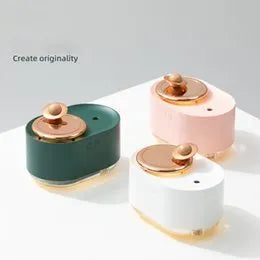 Green rotating planet-shaped USB humidifier with night light on a table