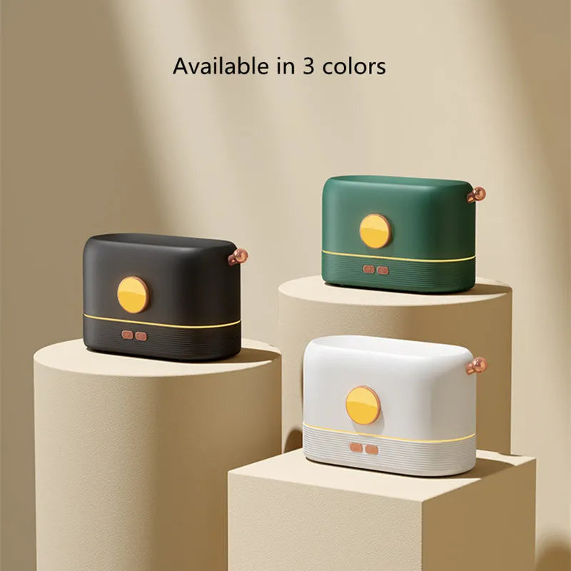 Black USB desktop humidifier with glowing simulated flame effect and water mist output.