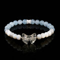 Women's natural starlight pink crystal cat head bracelet with copper detail and geometric round beads