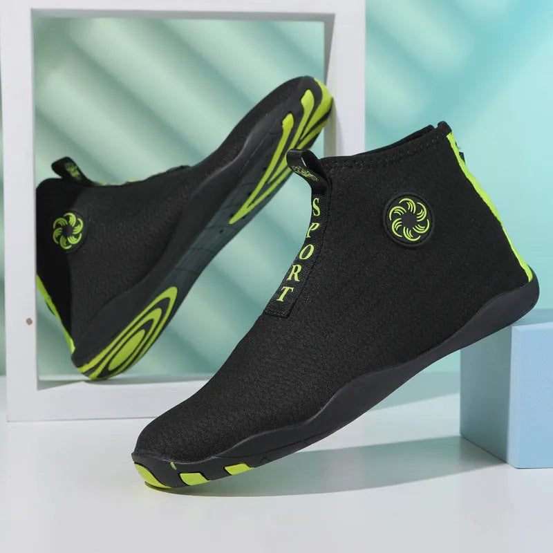 Black and fluorescent green mesh upstream beach shoes with a non-slip rubber sole.