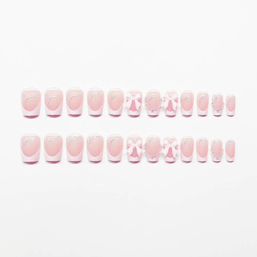 Short white French false nails with cute bow and tulip patterns in sweet style for ladies