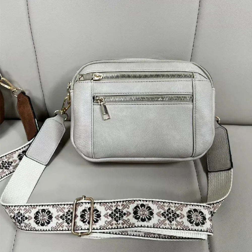 Triple-zipper colourblock crossbody bag with floral embroidered strap for women