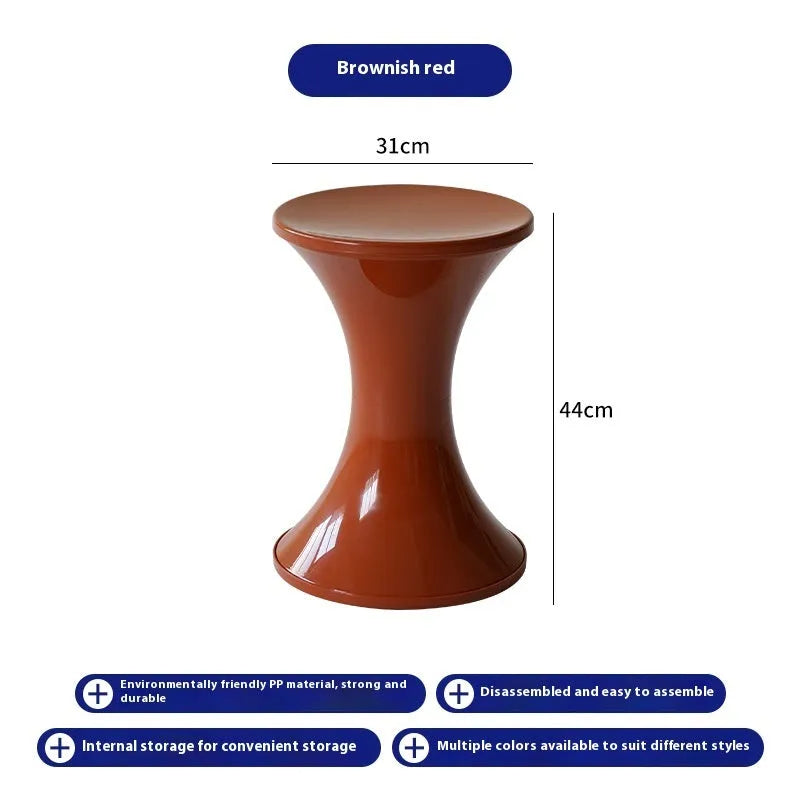 Plastic hourglass shoe changing stool in selected colour on flat surface