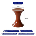Plastic hourglass shoe changing stool in selected colour on flat surface