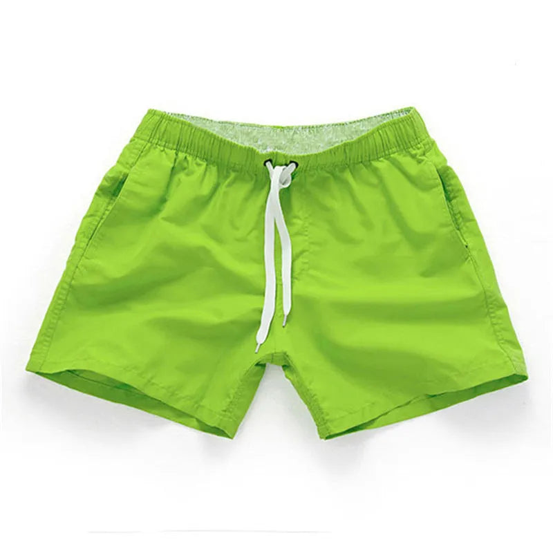 Men's polyester beach shorts in black, shown laid flat, featuring a straight leg opening.