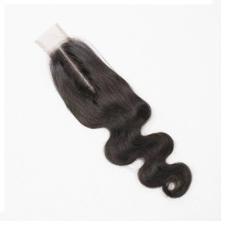A woman wearing a straight, natural colour human hair wig with long, sleek strands.