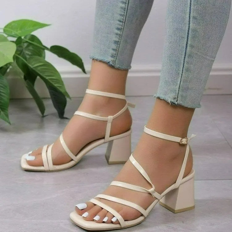 Beige plus size open toe slippers with a square toe and ankle buckle on a rubber sole.
