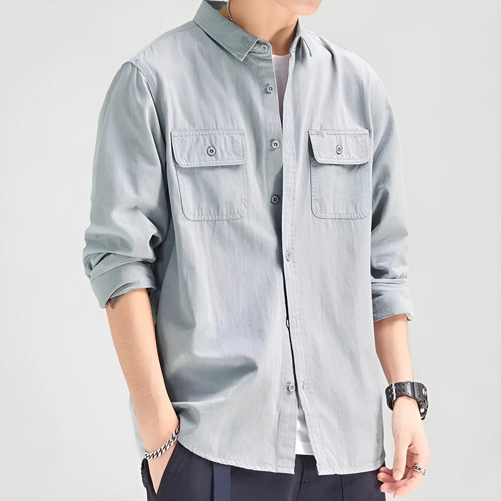 Man wearing a loose-fit light grey polyester cardigan shirt with long sleeves and an overalls design detail.
