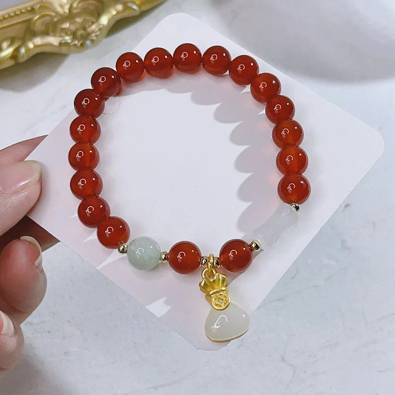 Red agate bracelet with Chinese lucky bag design and dragon motifs for women