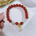 Red agate bracelet with Chinese lucky bag design and dragon motifs for women