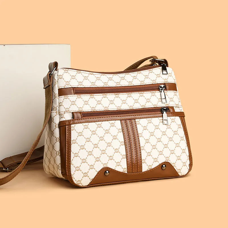 Women's large-capacity crossbody bag in brown or white with PU outer, polyester lining, and stitching pattern