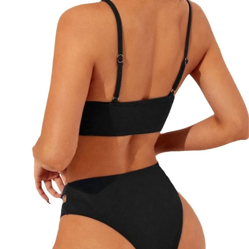Black hollow solid colour women's bikini set with sleeveless top and brief bottom on model