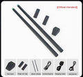 Black wireless somatosensory air drum kit host unit with drumsticks on a table.