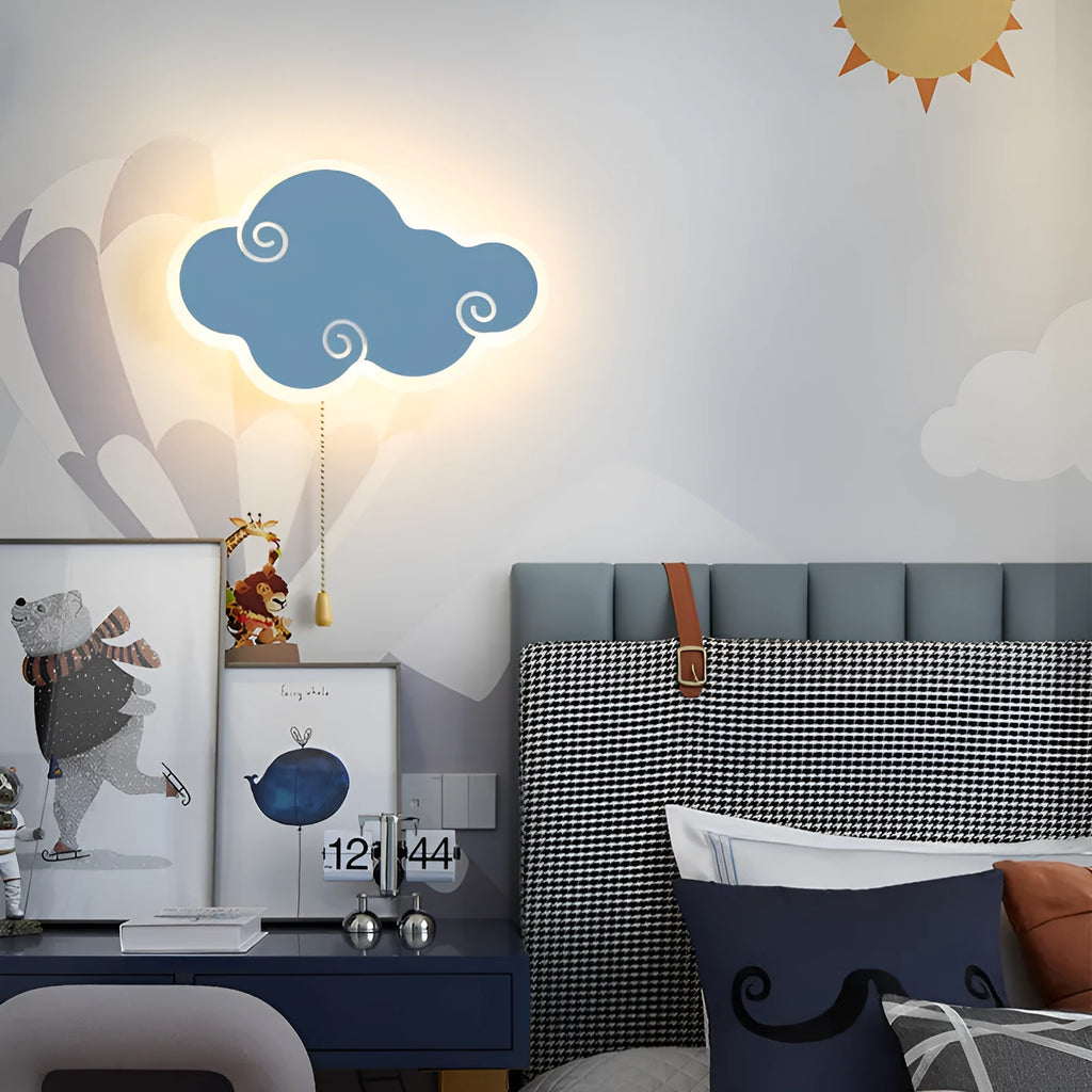 Modern white cloud-shaped acrylic wall lamp mounted on a blue bedroom wall.