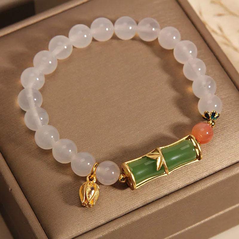 Women's white agate jade bead bracelet with bamboo joint beading in a retro Chinese style.
