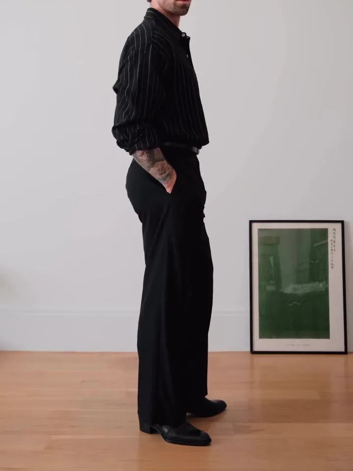 Black pinstriped button-down shirt with regular fit and traditional collar on mannequin