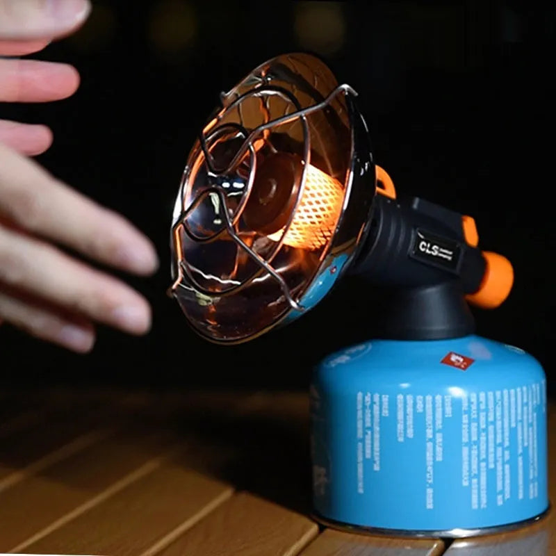 Black and orange portable outdoor heating stove with automatic ignition for camping