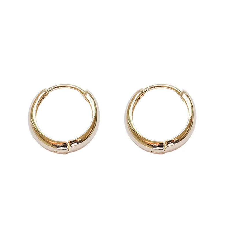 Women's geometric water drop earrings in gold and silver electroplated finishes showing minimalist retro design