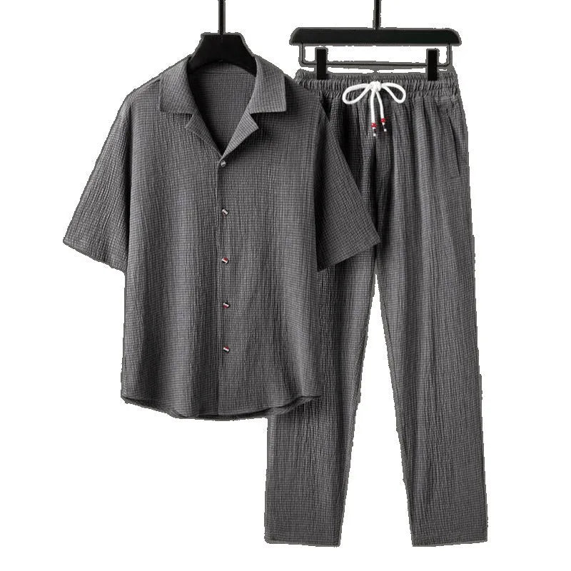 Men's Chinese style two-piece knitwear set showing short-sleeved top and trousers in polyester fabric