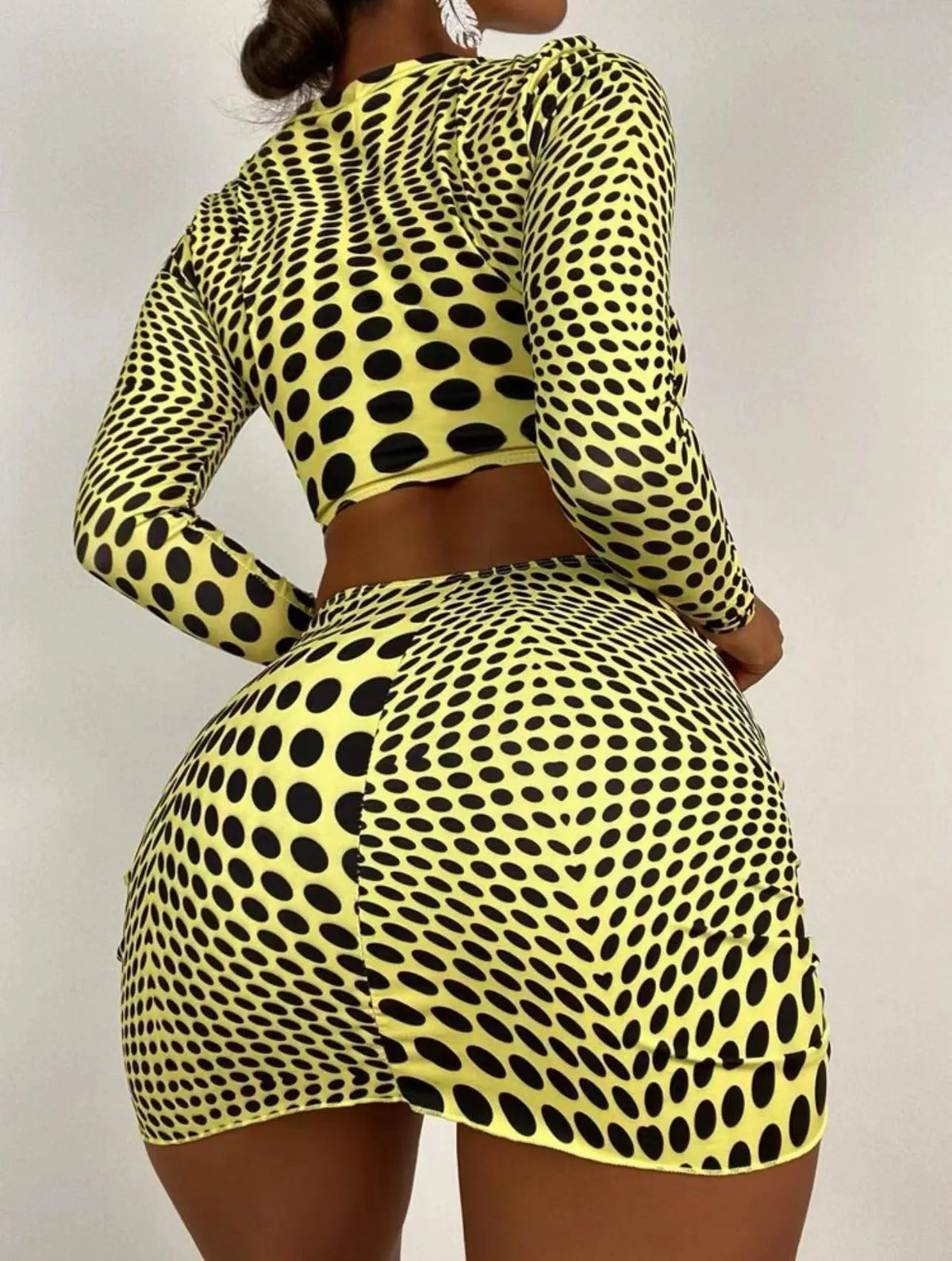 Women's green polka dot swimsuit three-piece set showing top, skirt, and bra.