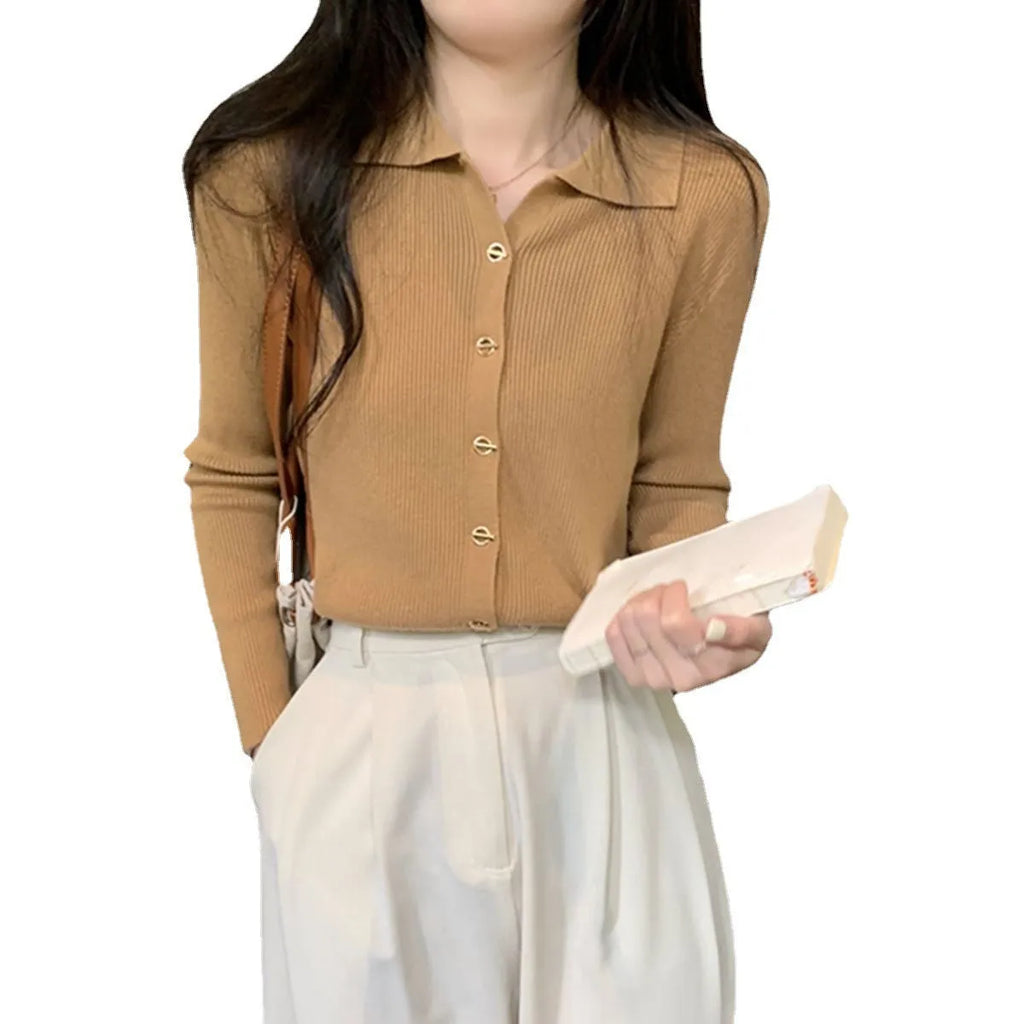Long-sleeved beige viscose knitted cardigan top shown loose fit on a hanger