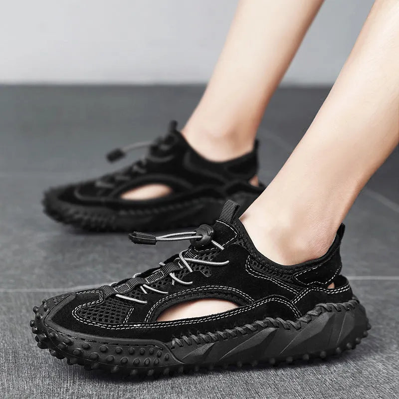 Men's black outdoor sports sandals with leather mesh upper and rubber sole showing elastic band closure