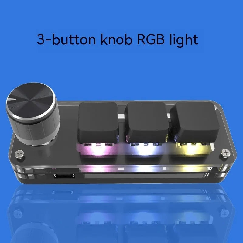 Black macro keypad with RGB backlit keys for copy paste commands beside USB cable