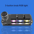Black macro keypad with RGB backlit keys for copy paste commands beside USB cable