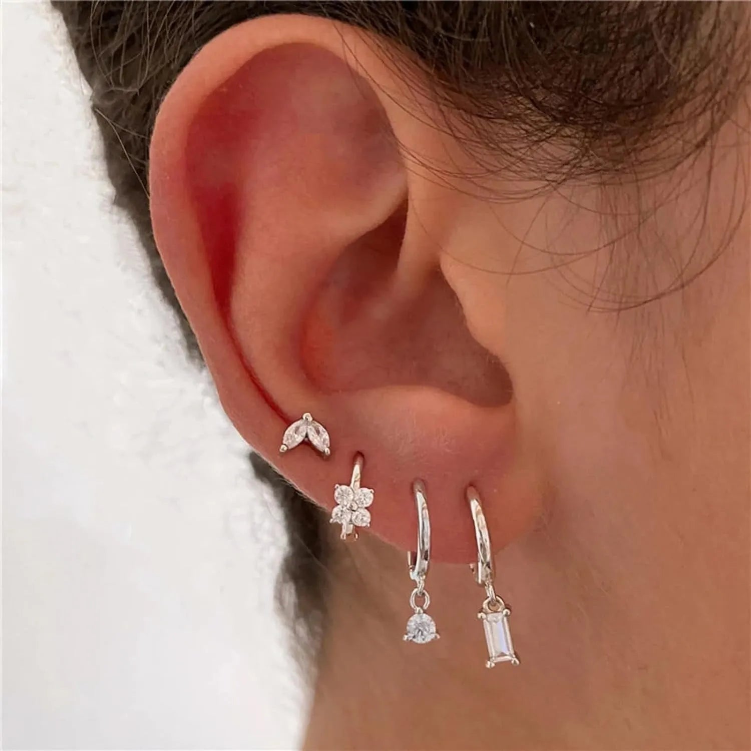 Geometric square copper earrings with zircon plating in gold or silver colour, showing star, quadrilateral, ellipse and ring shapes