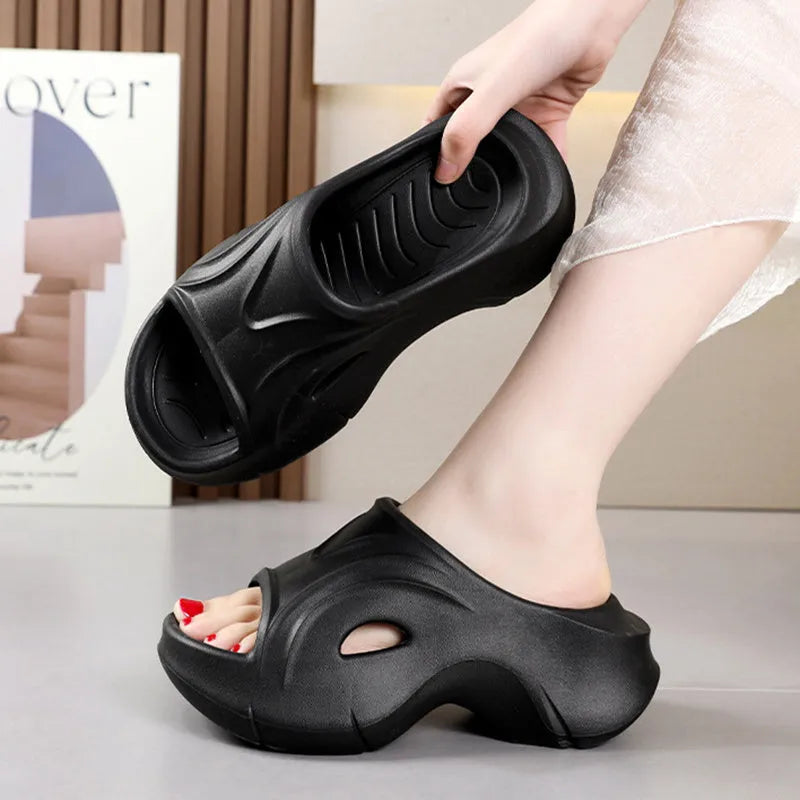 Women's white thick-soled EVA slippers with round toe on a beach background